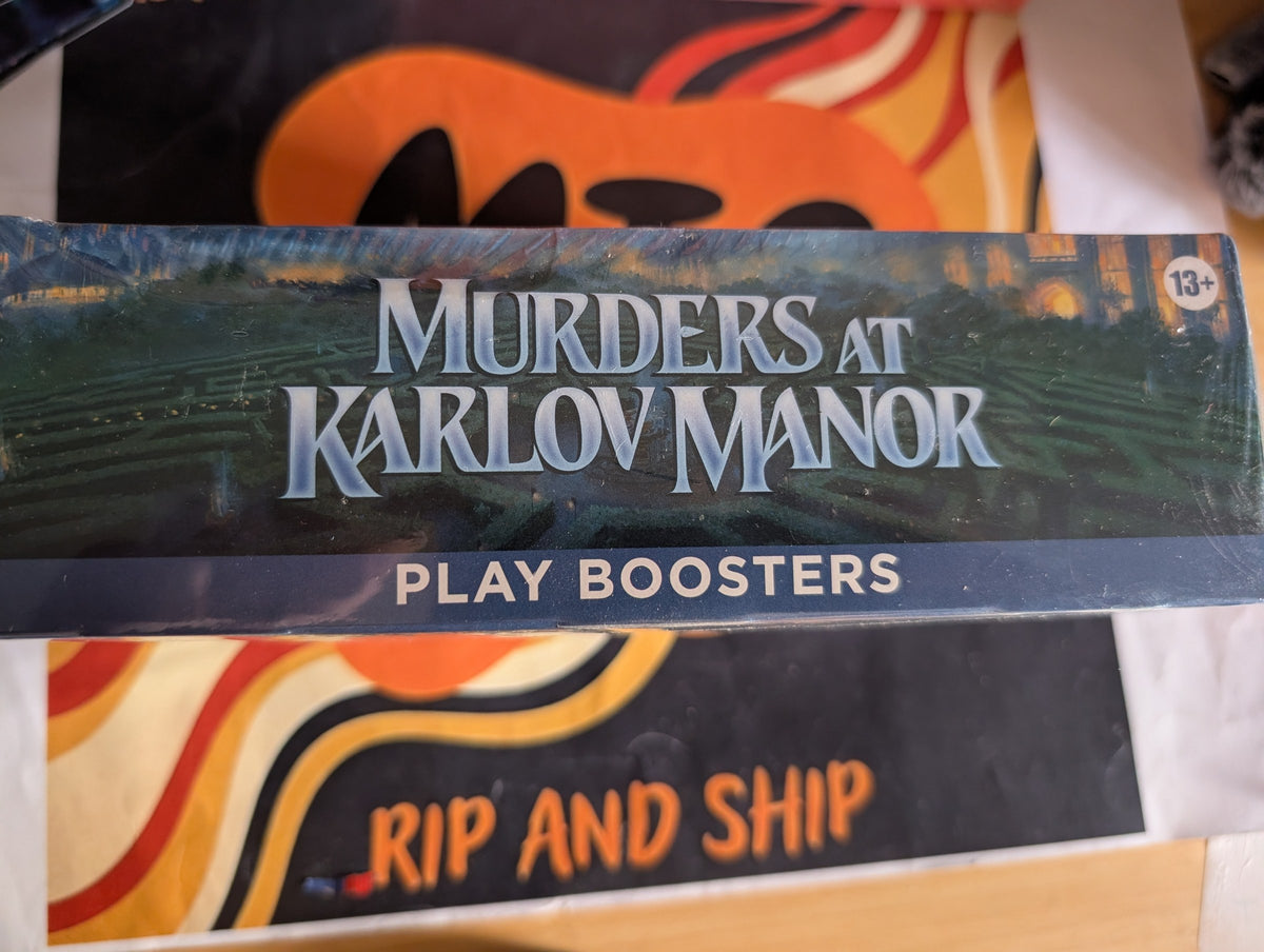 Murders at Karlov Manor Play Booster Box — sealed, real product photo (side)
