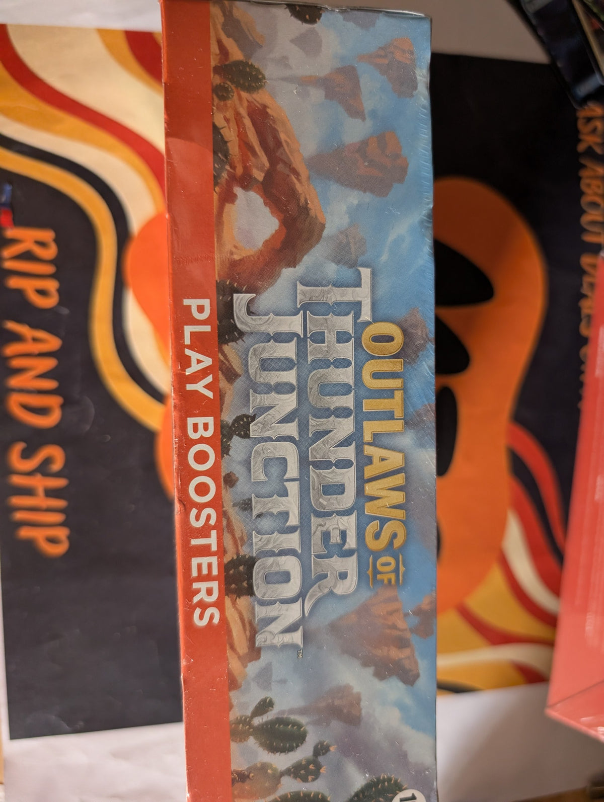 Outlaws of Thunder Junction Play Booster Box — sealed, real product photo (side)